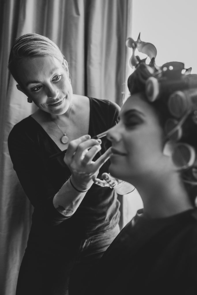 Bride getting ready in hair and makeup