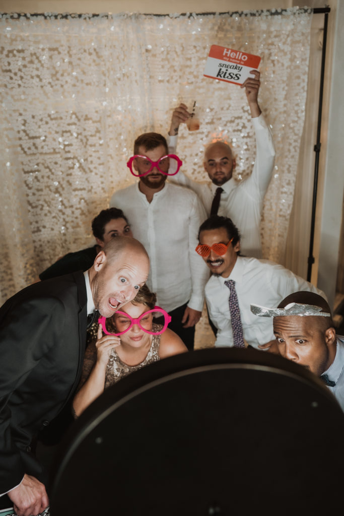 friends at wedding photo booth