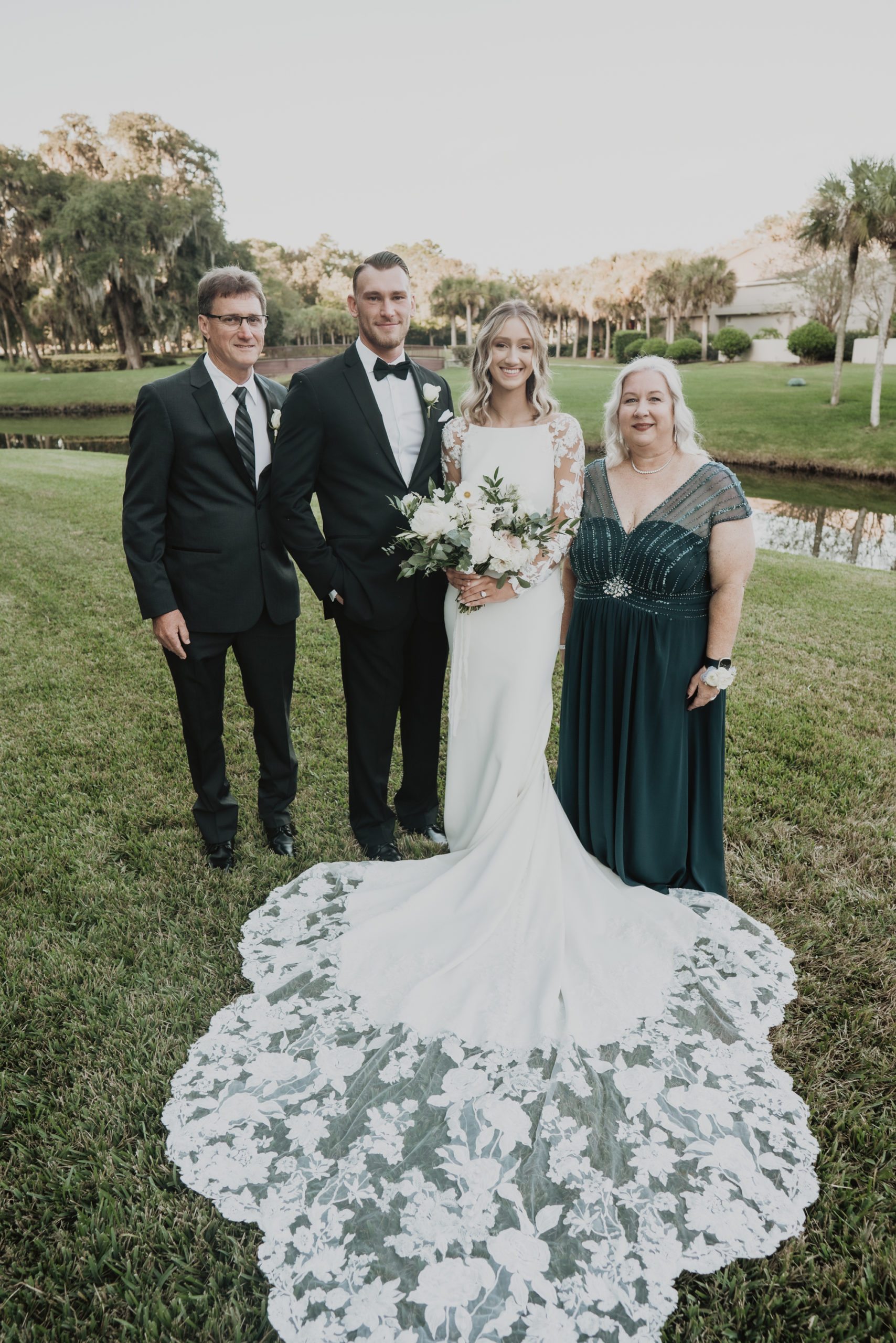 bride and groom with parents